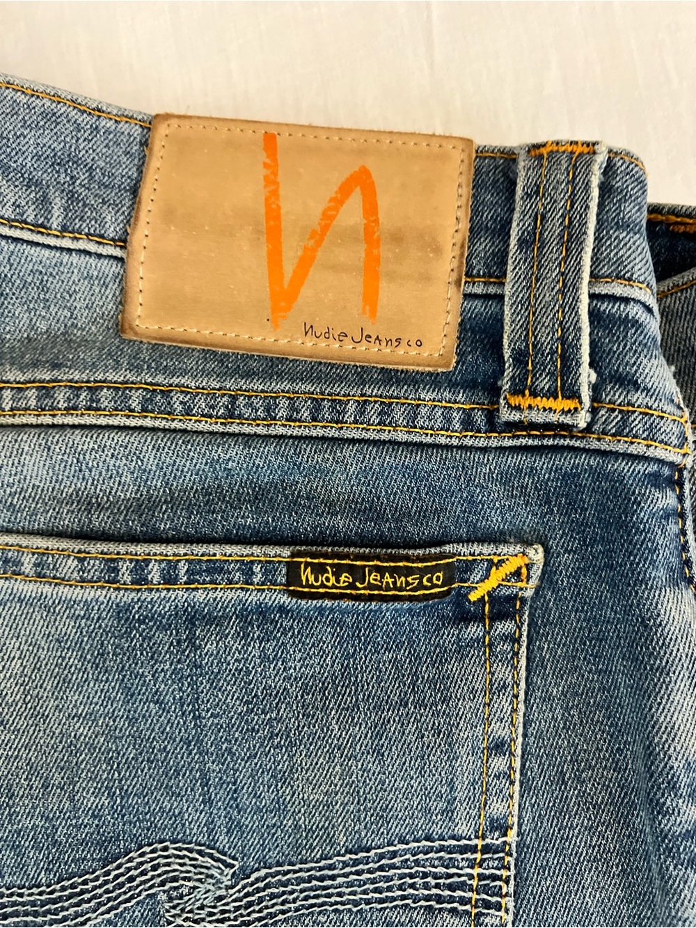 Nudie Jeans Light Blue Straight Jeans with Tan Leather Patch